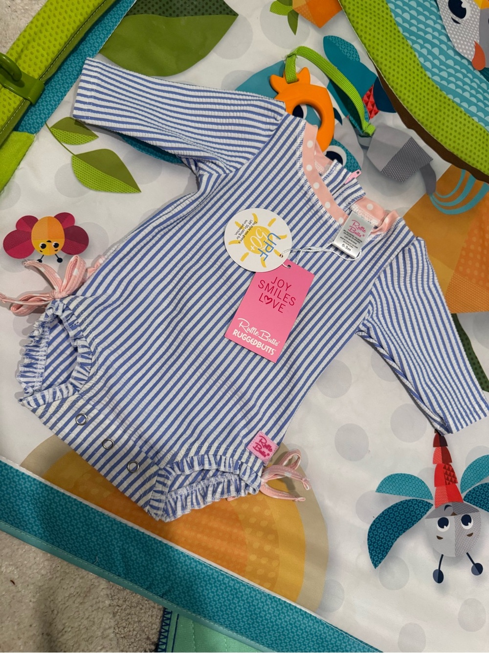 Ruffle Butts Blue & White Striped Baby Romper with Pink Trim